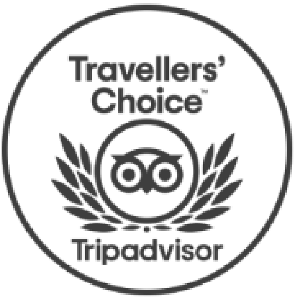 A circular travel seal reading “Traveler's Choice” with a laurel wreath, binoculars icon, and the word “Tripadvisor” at the bottom.