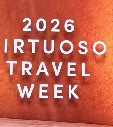 A sign reads “2026 Virtuoso Travel Week”.