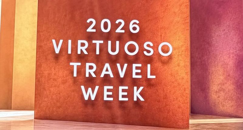 A sign reads “2026 Virtuoso Travel Week”.
