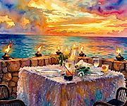 Candlelit seaside dinner on a rocky shore at sunset, with plates, drinks, and burning tapers by the water.